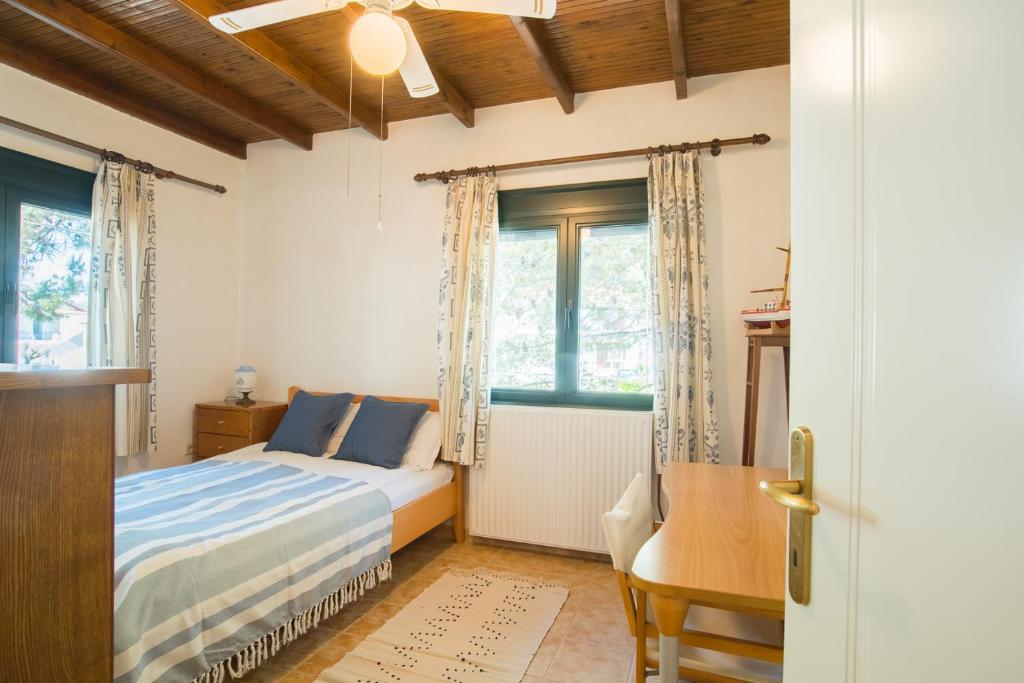 Postel nebo postele na pokoji v ubytování Villa Pefka
