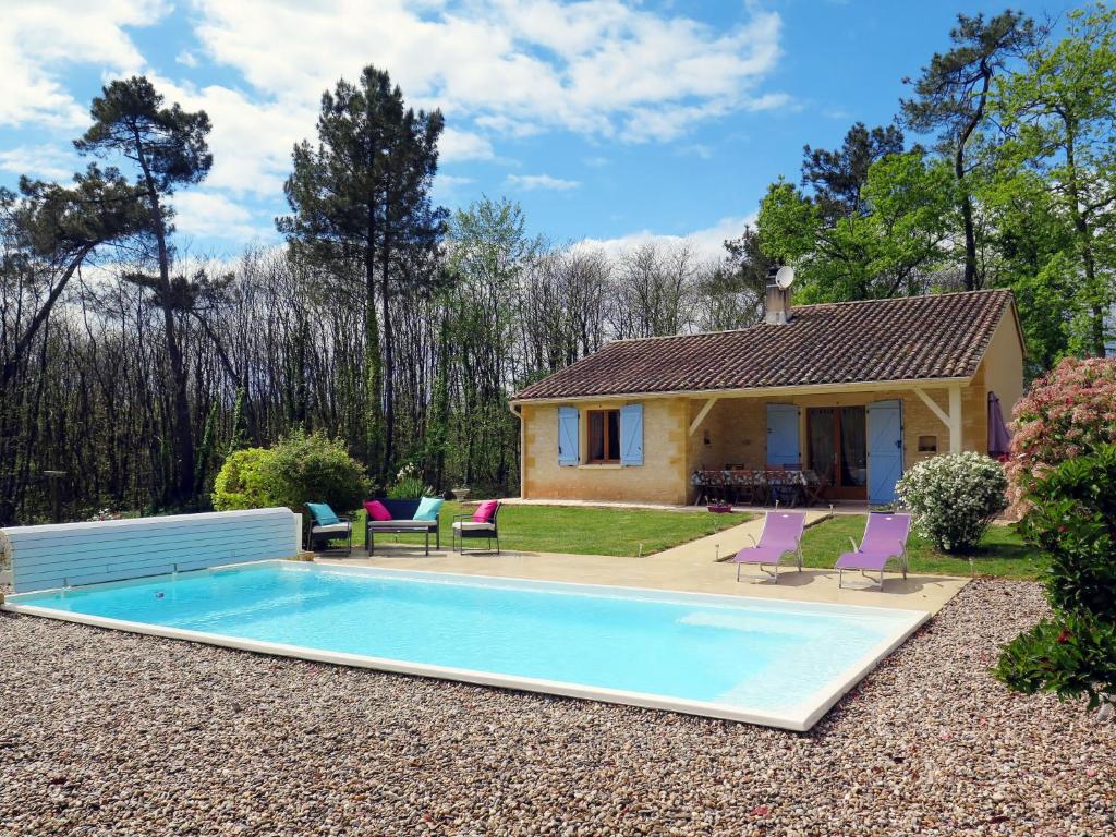 a house with a swimming pool in the yard at Holiday Home Au Cayroux - BSB302 by Interhome in Blanquefort-sur-Briolance