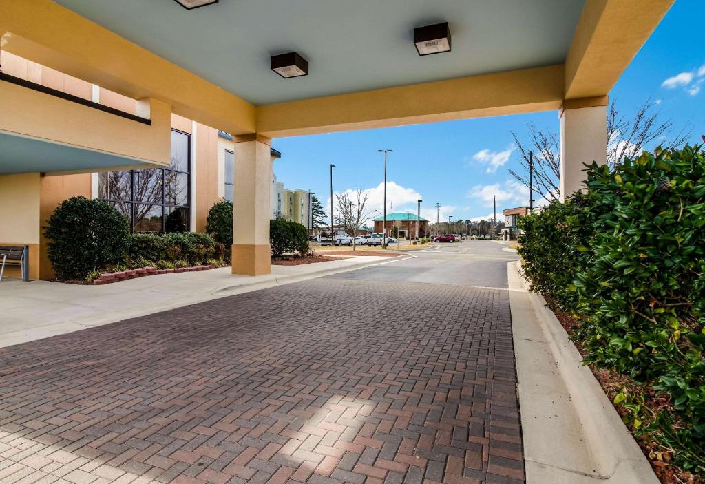 a building with a brick road in a mall at Clarion Pointe New Bern in New Bern