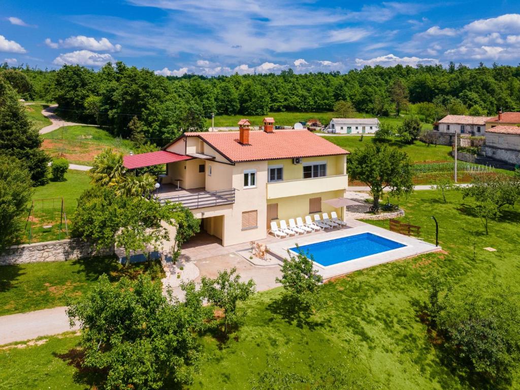 an aerial view of a house with a swimming pool at Holiday Home Larisa - IPC141 by Interhome in Pićan