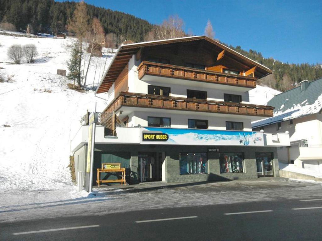 a building on the side of a snow covered mountain at Apartment Erika by Interhome in Kappl