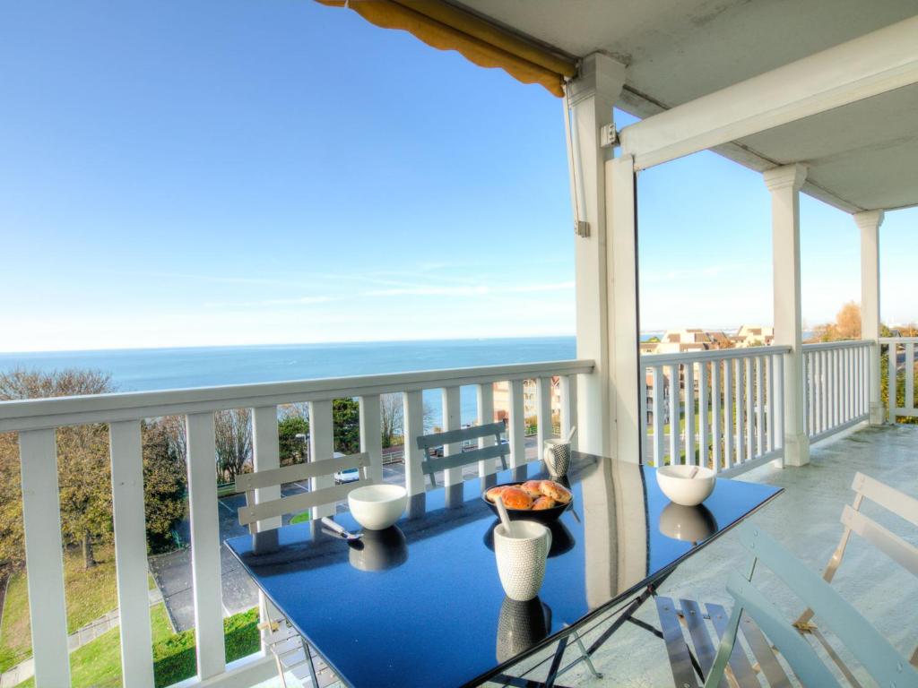 a balcony with a view of the ocean at Apartment Le Parc Cordier-3 by Interhome in Trouville-sur-Mer