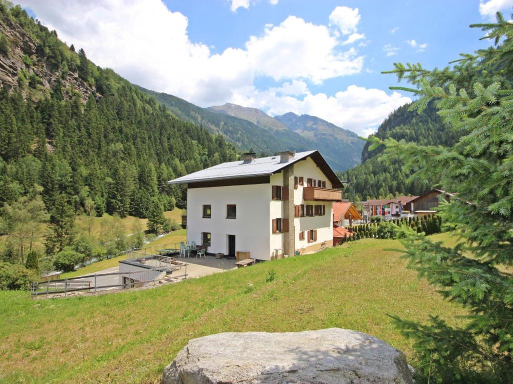 a house on top of a hill with a field at Holiday Home Wiese by Interhome in Oberlehn