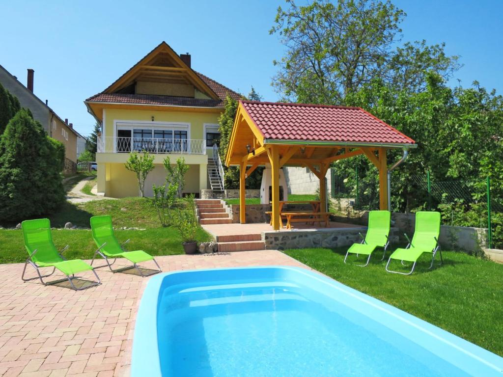 a house with a swimming pool and a gazebo at Apartment Beate - BAC121 by Interhome in Badacsonytomaj