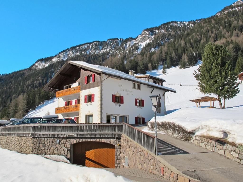 a building with a bridge in the snow at Holiday Home Kostner by Interhome in Bulla
