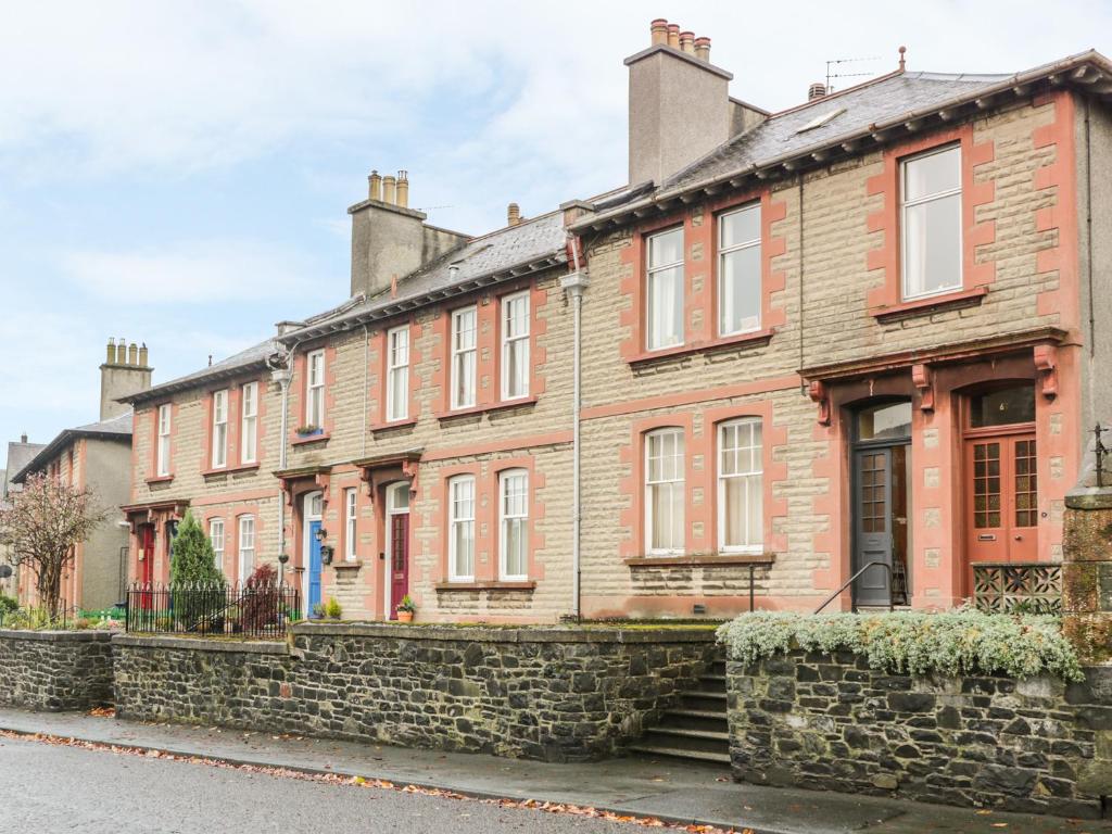 a row of brick houses on a street at 63 Rosetta Road in Peebles