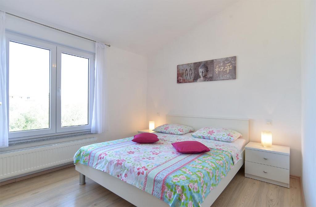 Postel nebo postele na pokoji v ubytování Apartments Jere 719