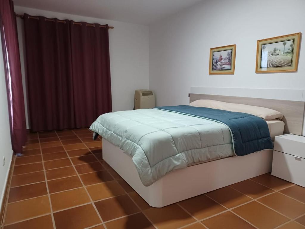 Postel nebo postele na pokoji v ubytování APARTAMENTO MAYI 2