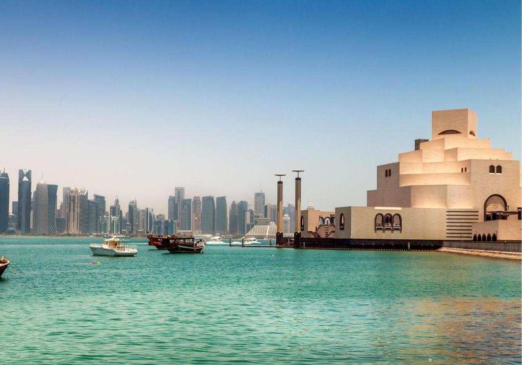 a view of a city with boats in the water at Best Plaza West Bay Hotel in Doha