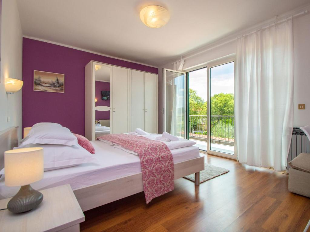 Postel nebo postele na pokoji v ubytování Holiday Home Anka by Interhome