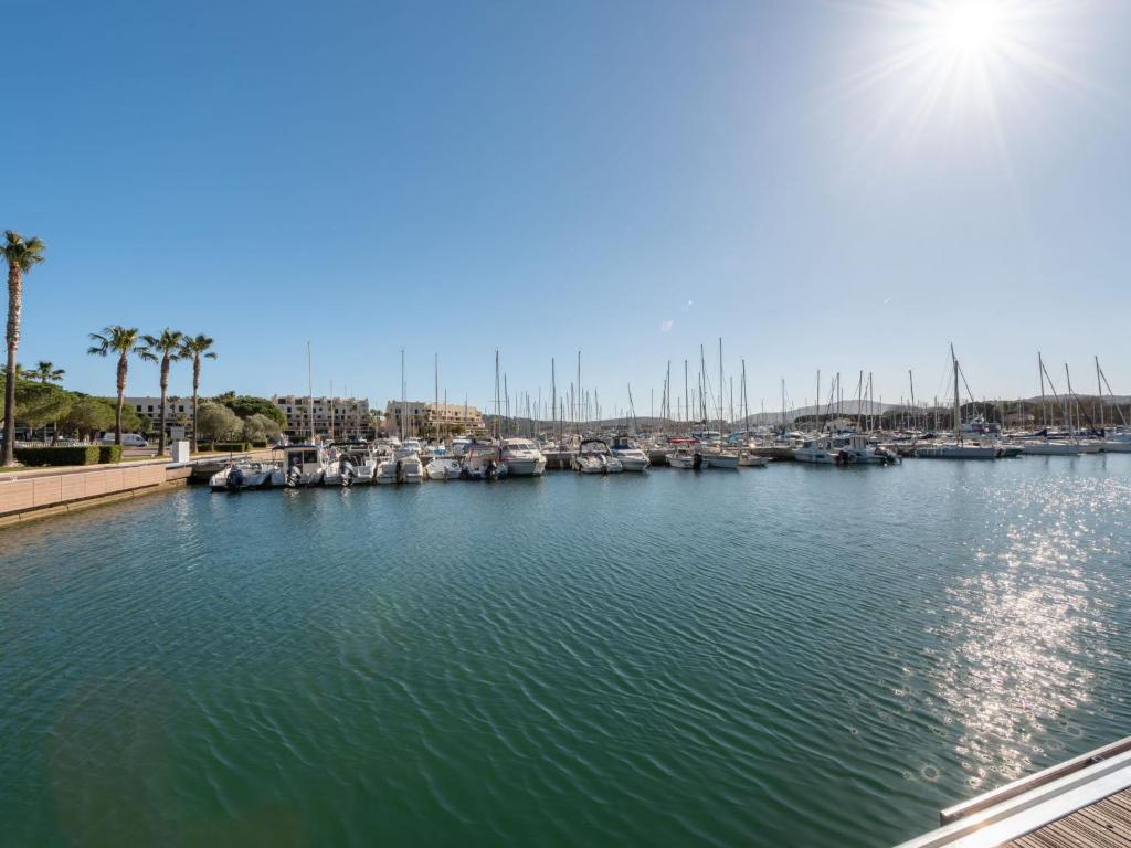 a view of a marina with boats in the water at Apartment Les Cascadelles-2 by Interhome in La Foux