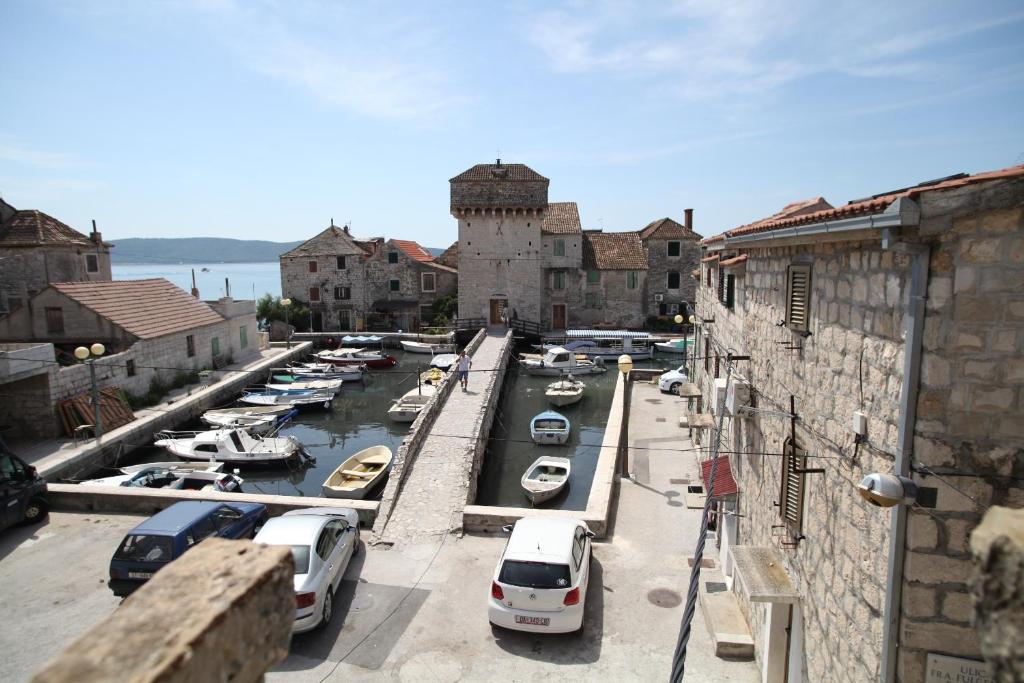 a bunch of boats are parked in a harbor at Apartments More in Kaštela