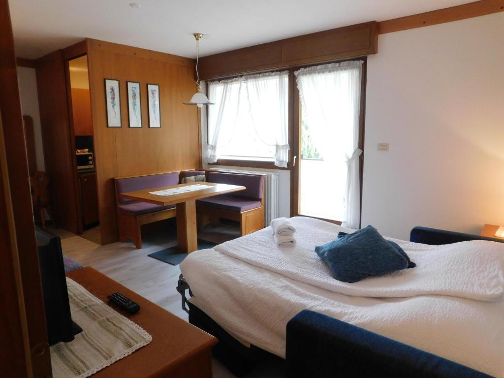 Posteľ alebo postele v izbe v ubytovaní Ski Residence