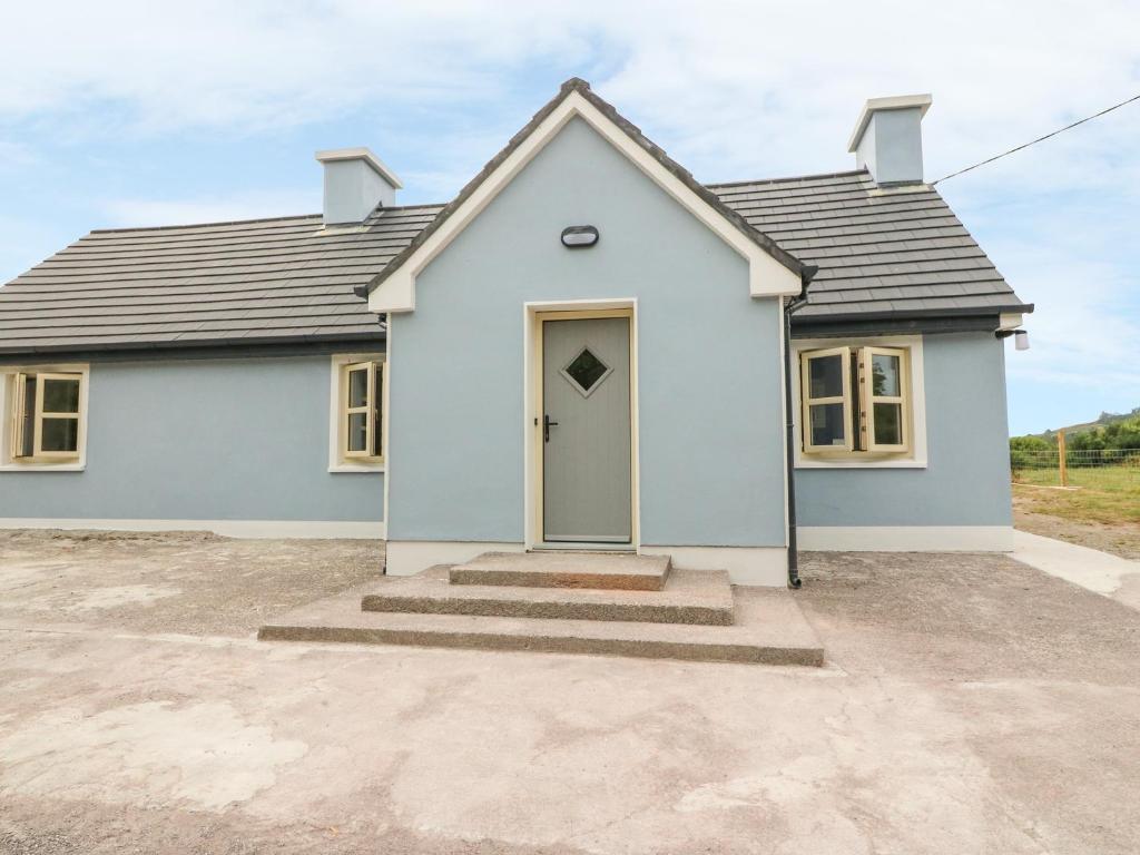 a home with a blue house at Dromstabla in Glencar