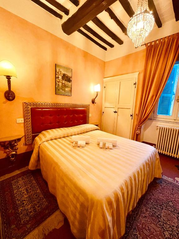Postel nebo postele na pokoji v ubytování Palazzo Barbini Dimora Storica