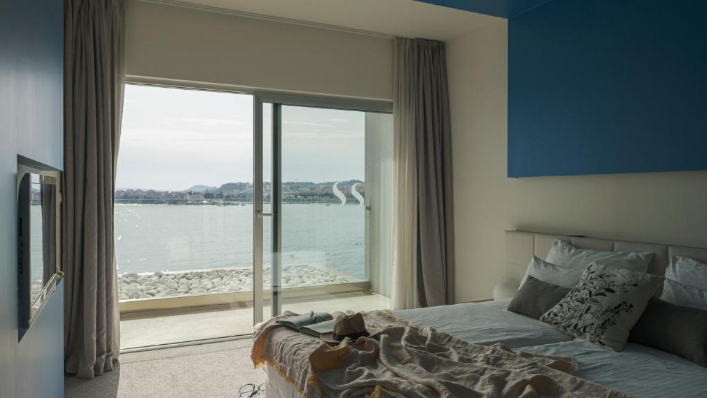 Postel nebo postele na pokoji v ubytování Hotel Split