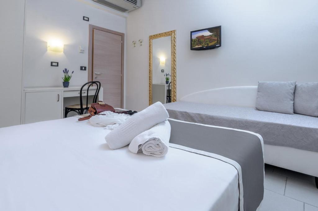 Postel nebo postele na pokoji v ubytování Atlas Hotel