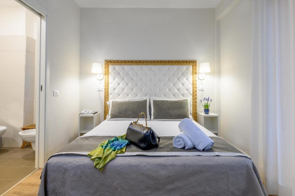 Postel nebo postele na pokoji v ubytování Atlas Hotel