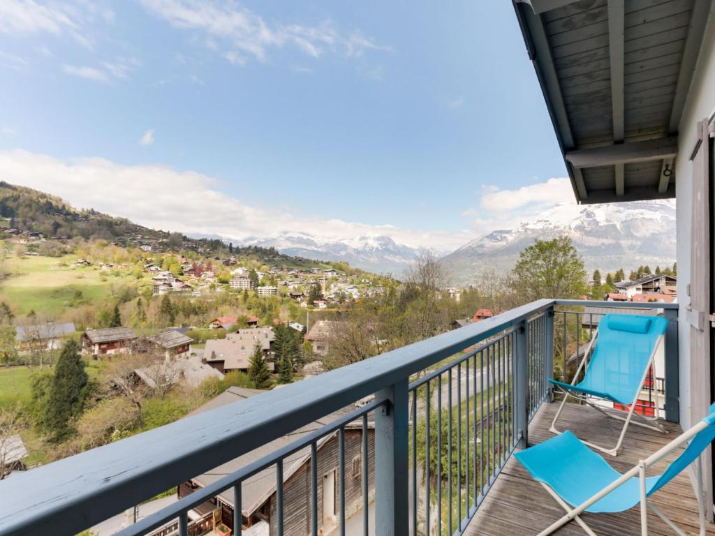 a balcony with chairs and a view of mountains at Apartment Les Gentianes by Interhome in Saint-Gervais-les-Bains