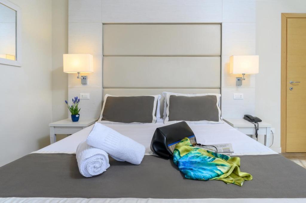 Postel nebo postele na pokoji v ubytování Atlas Hotel