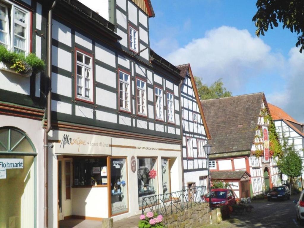 a black and white building in a town at Apartment Mönkemeierhof by Interhome in Schieder-Schwalenberg