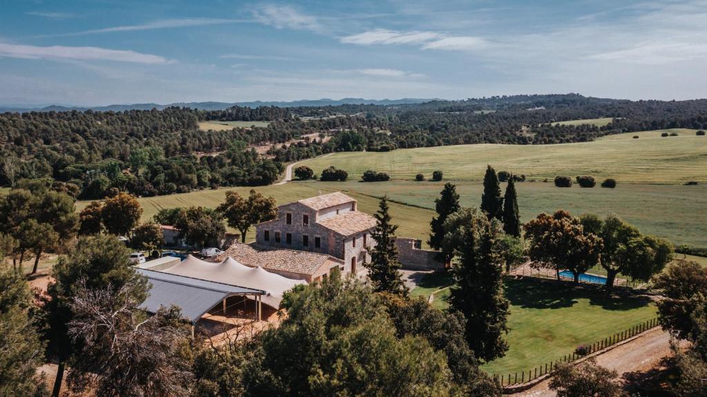 an aerial view of a house in a field at Les Quingles in Calders