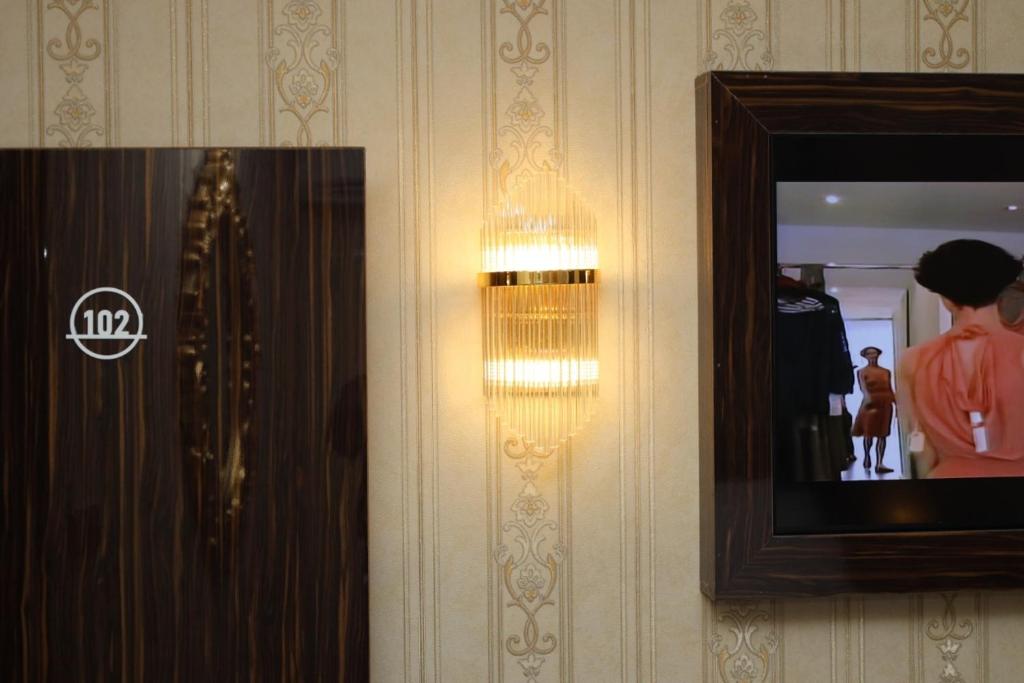 TV a/nebo společenská místnost v ubytování NO.1 HOTEL