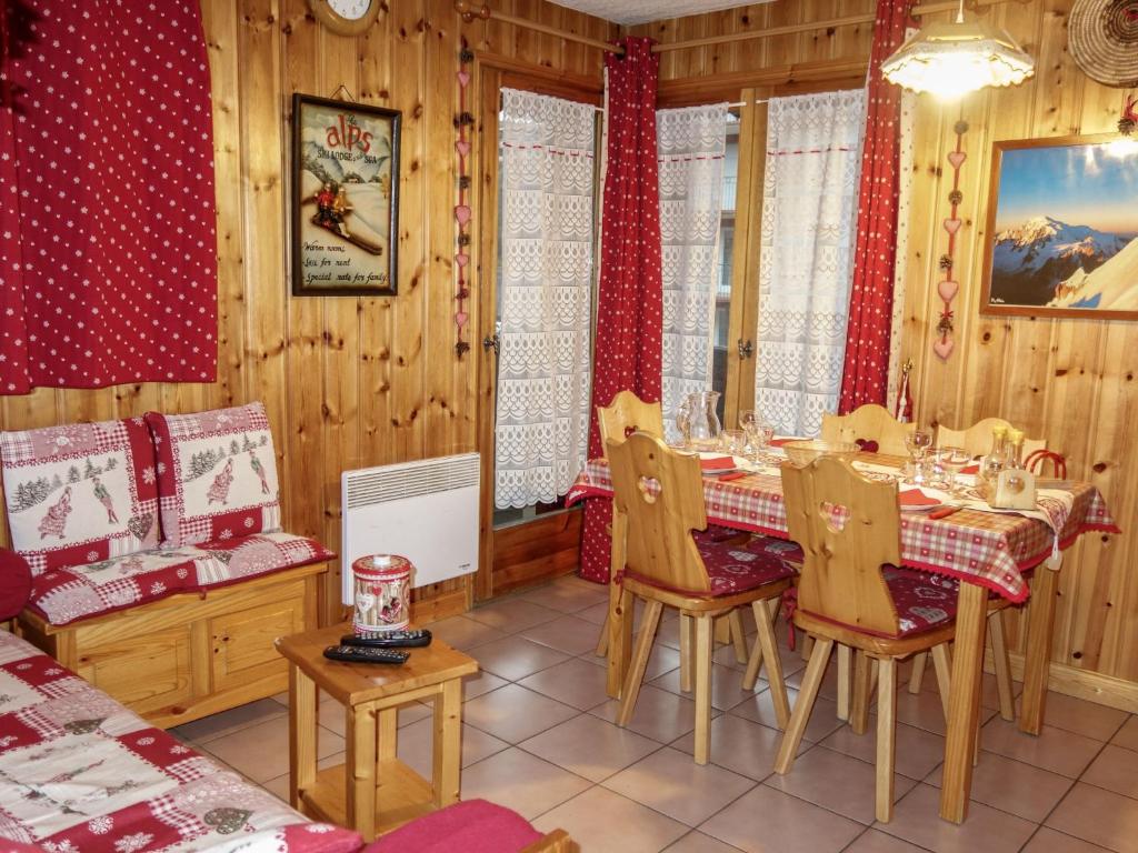 a dining room with a table and chairs in a room at Apartment Les Jardins Alpins-9 by Interhome in Saint-Gervais-les-Bains