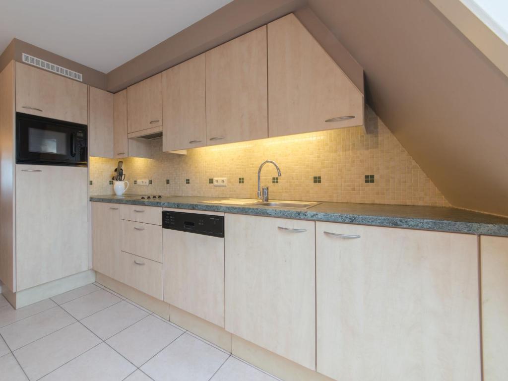 Kuchyň nebo kuchyňský kout v ubytování Apartment Meiboom 503 by Interhome