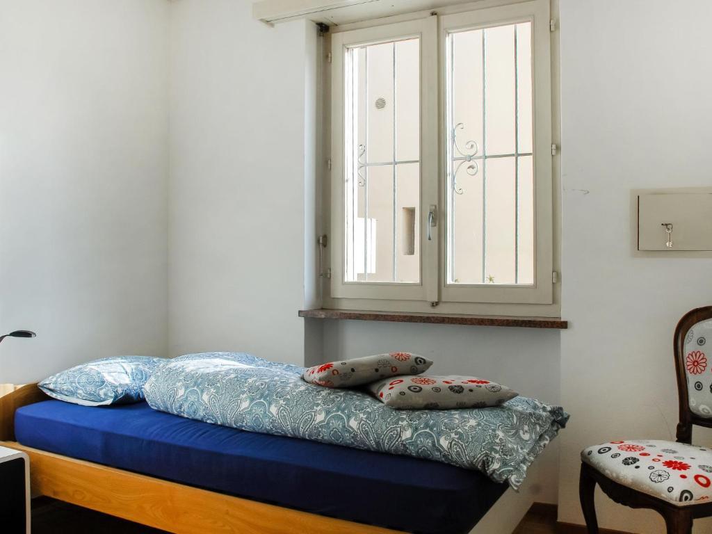 Postel nebo postele na pokoji v ubytování Apartment San Quirico by Interhome