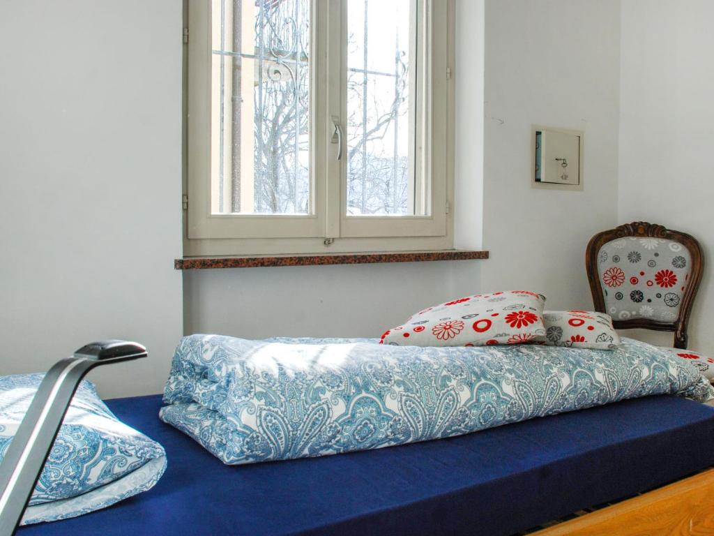 Postel nebo postele na pokoji v ubytování Apartment San Quirico by Interhome