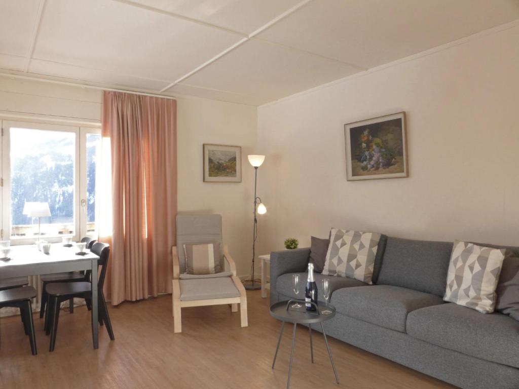 a living room with a couch and a table at Apartment Helene Apt Diana by Interhome in Wengen