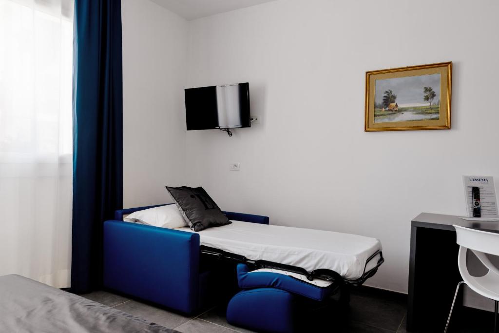 TV a/nebo společenská místnost v ubytování L'Essenza Hotel