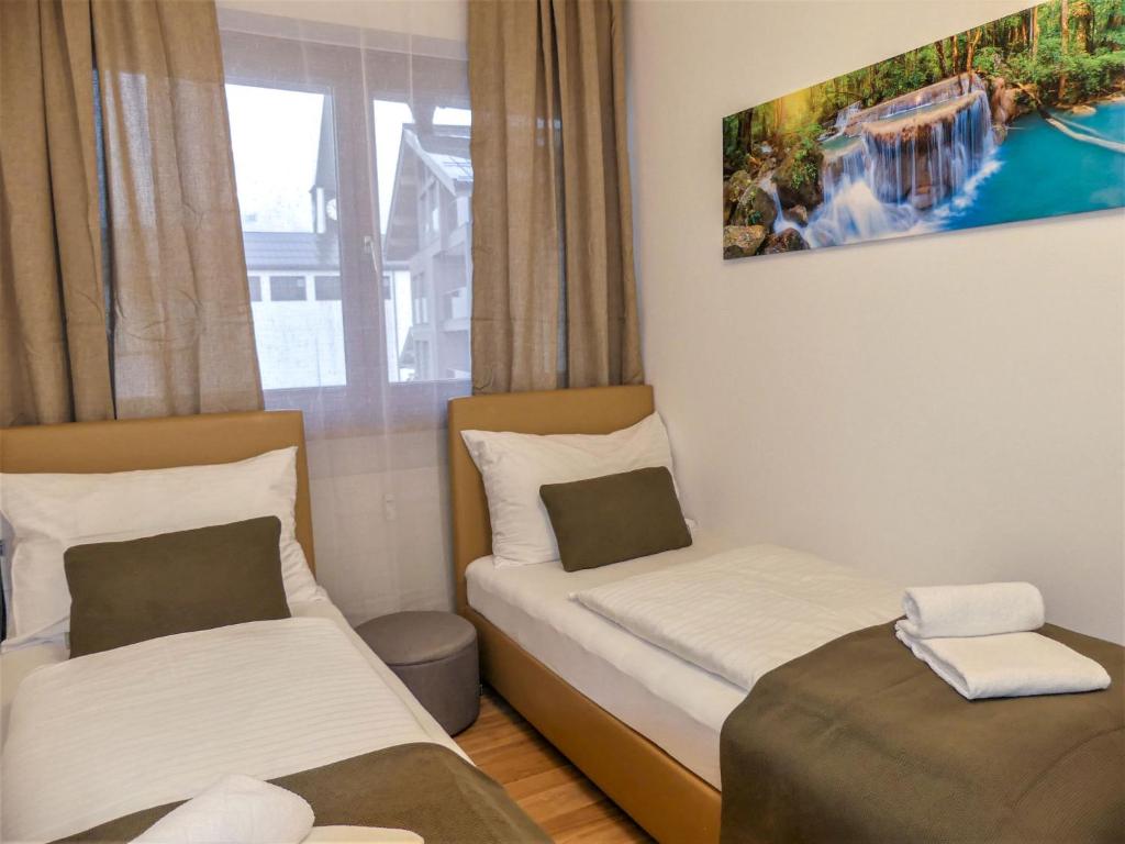 A bed or beds in a room at Apartment Sigel by Interhome