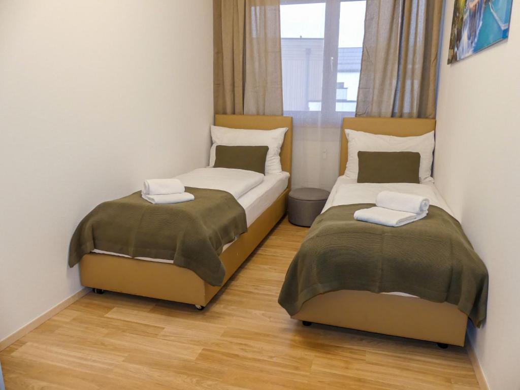 A bed or beds in a room at Apartment Sigel by Interhome