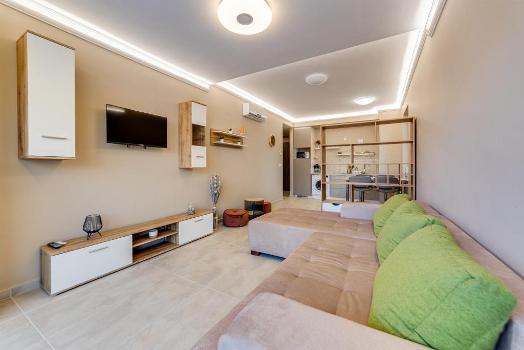 TV a/nebo společenská místnost v ubytování Forest Földvár Apartmanok By BLTN