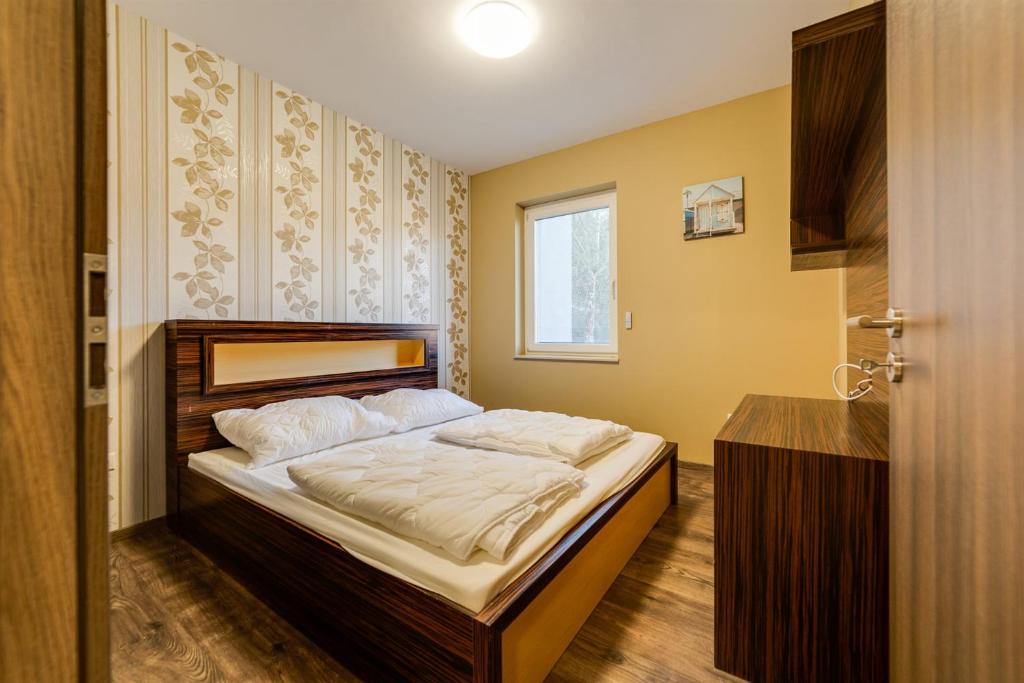 Postel nebo postele na pokoji v ubytování Forest Földvár Apartmanok By BLTN