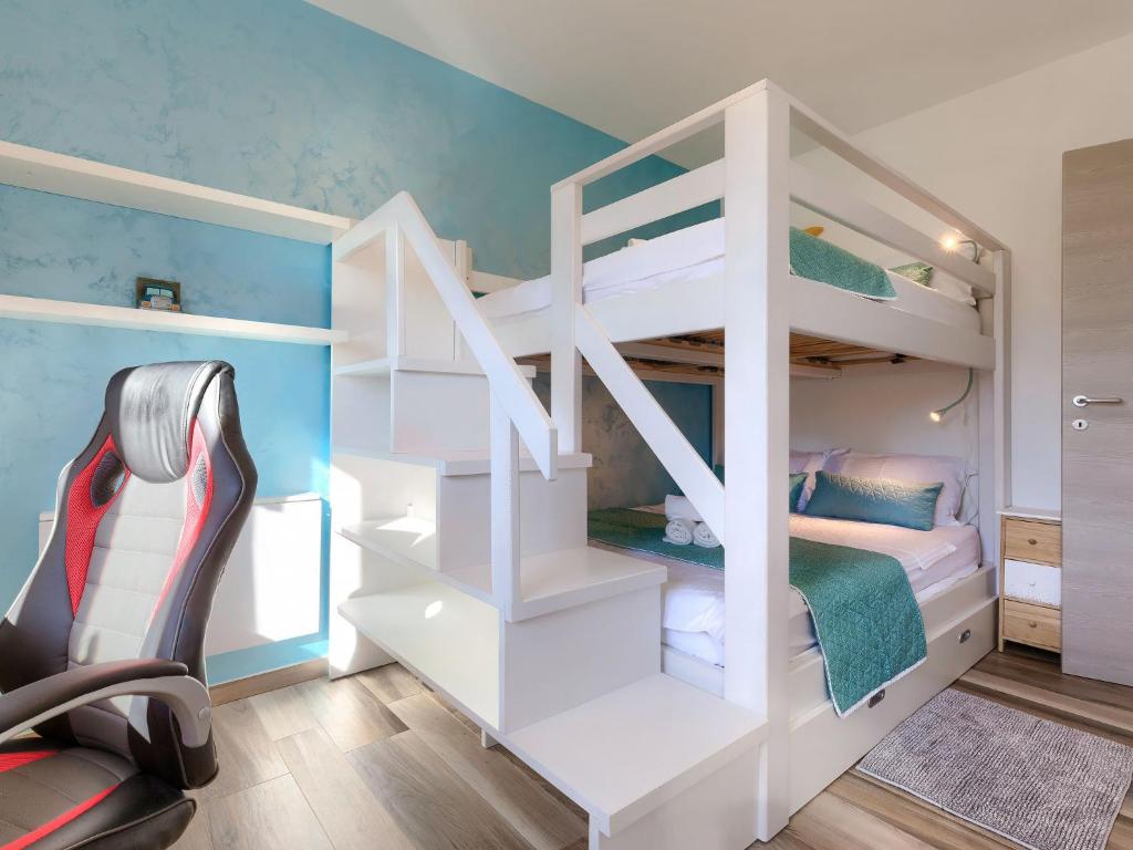 Łóżko lub łóżka w pokoju w obiekcie Holiday Home Villa Amaii by Interhome