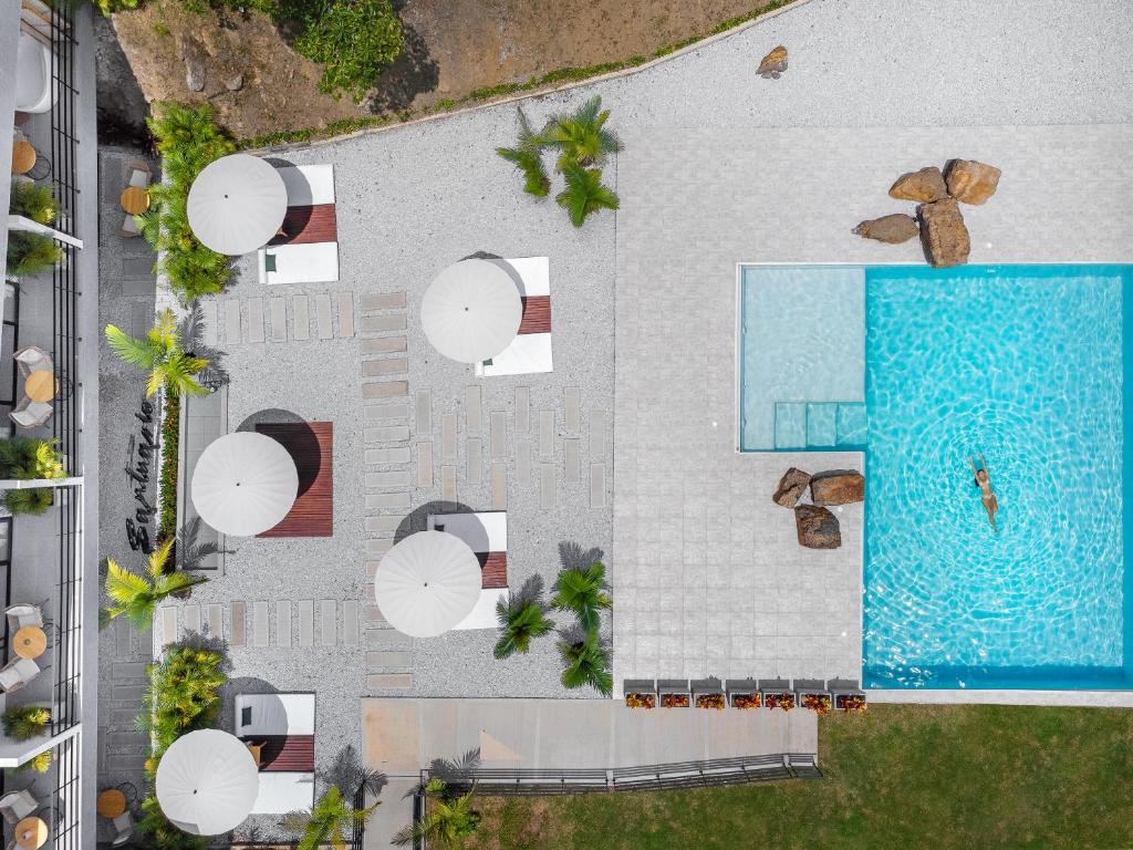an overhead view of a swimming pool next to a building at Santuario Luxury Eco Hotel in Villeta