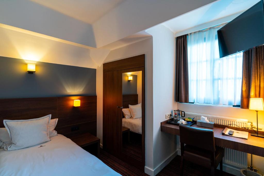 Postel nebo postele na pokoji v ubytování Hotel Villa Monte