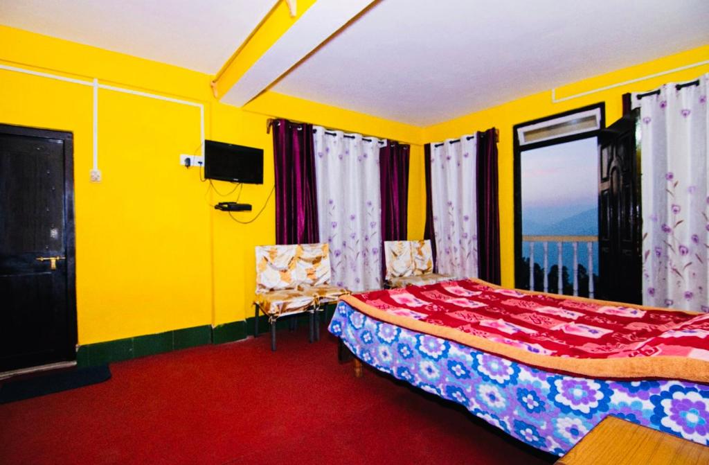 Postel nebo postele na pokoji v ubytování Dew Drop Homestay