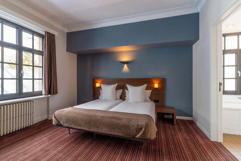 Postel nebo postele na pokoji v ubytování Hotel Villa Monte