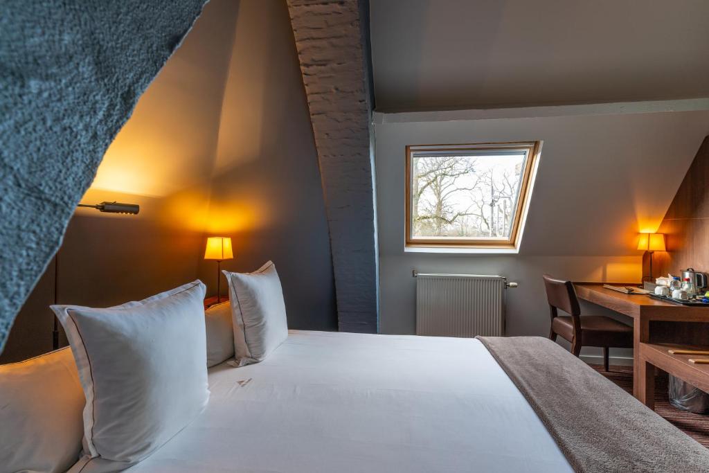 Postel nebo postele na pokoji v ubytování Hotel Villa Monte