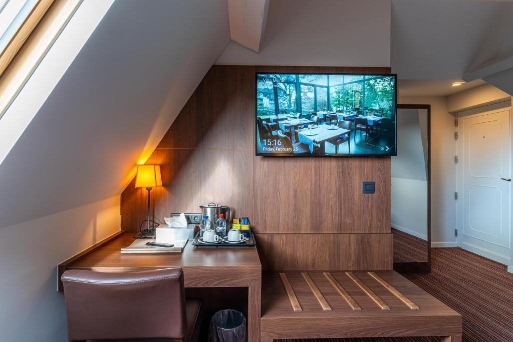 TV a/nebo společenská místnost v ubytování Hotel Villa Monte
