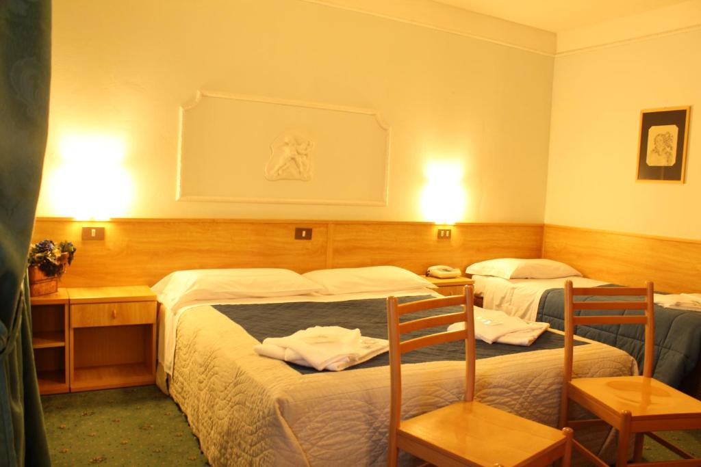 Postel nebo postele na pokoji v ubytování Hotel Villanova