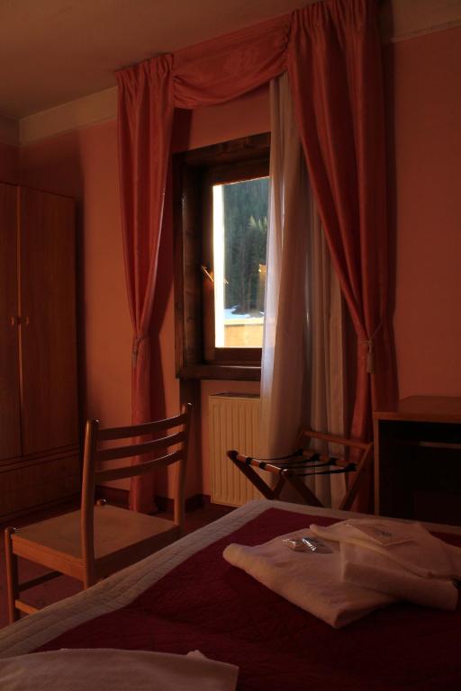 Postel nebo postele na pokoji v ubytování Hotel Villanova