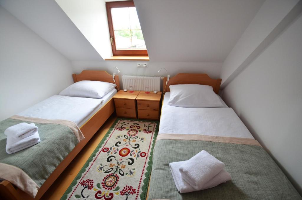 Postel nebo postele na pokoji v ubytování B&B Pod Skalo