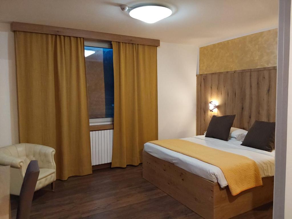 Postel nebo postele na pokoji v ubytování Hotel Casagrande