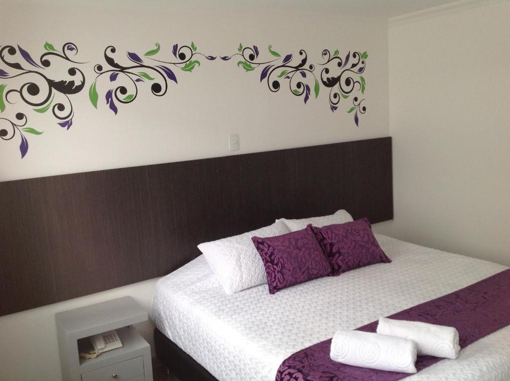 Postel nebo postele na pokoji v ubytování Hotel Burana