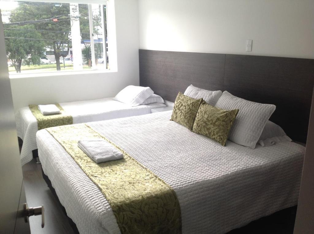 Postel nebo postele na pokoji v ubytování Hotel Burana